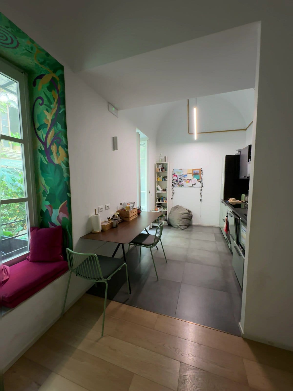 BeetCommunity kitchen and dining nook with botanical mural, garden window seat and dining table