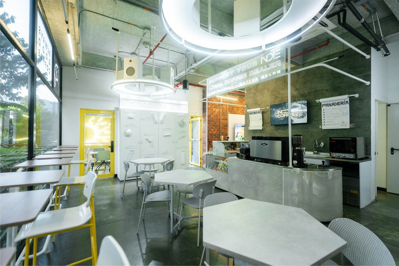 Indie Market café and lounge at Indie Studio with a coffee bar, communal tables and natural light in Medellín