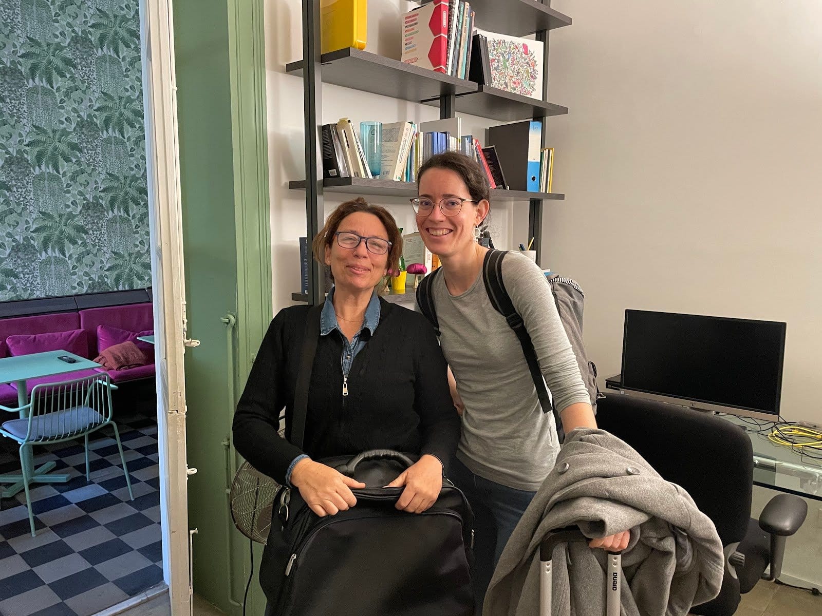 BeetCommunity two coliving members smiling together in the shared coworking and lounge space