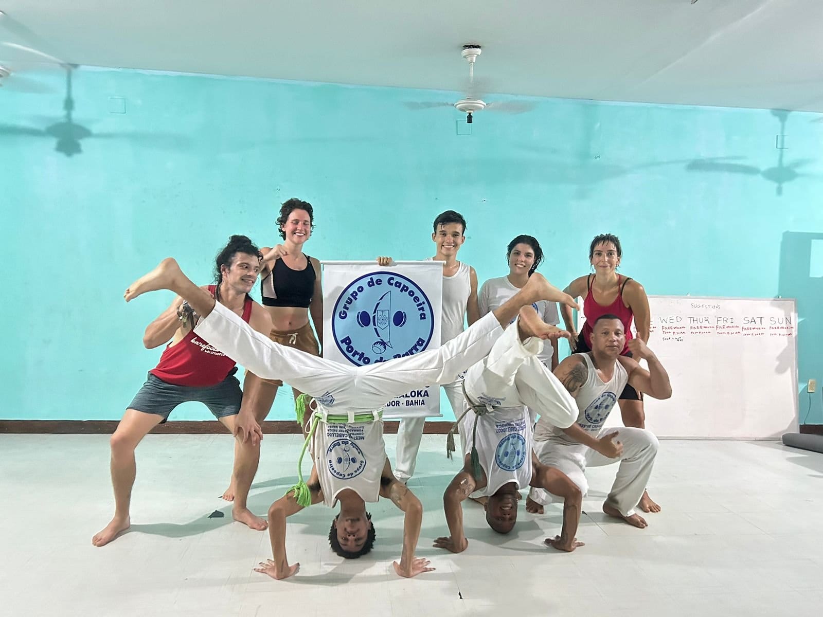 Capoeira group gathered in the activity room at Nomads Multiespaço, Salvador