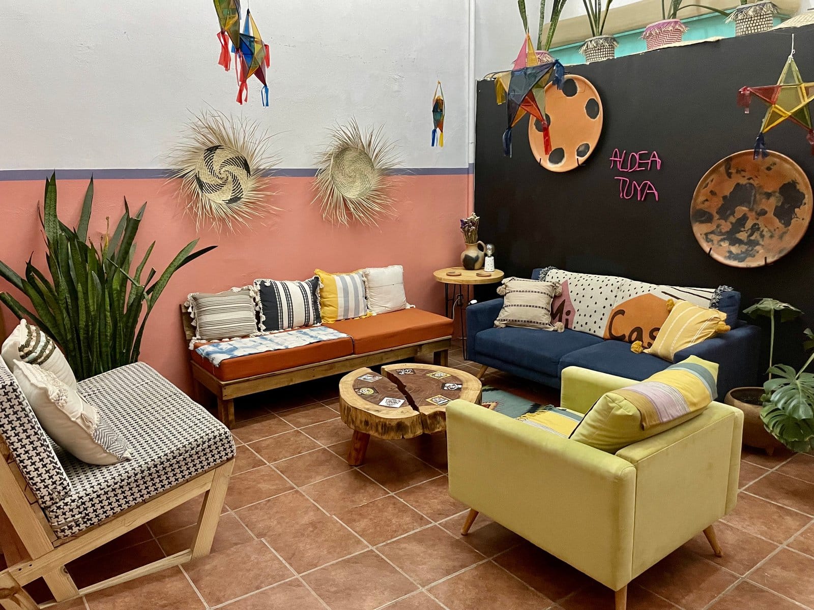 Colorful communal living room with Oaxacan decor at Aldea Tuya