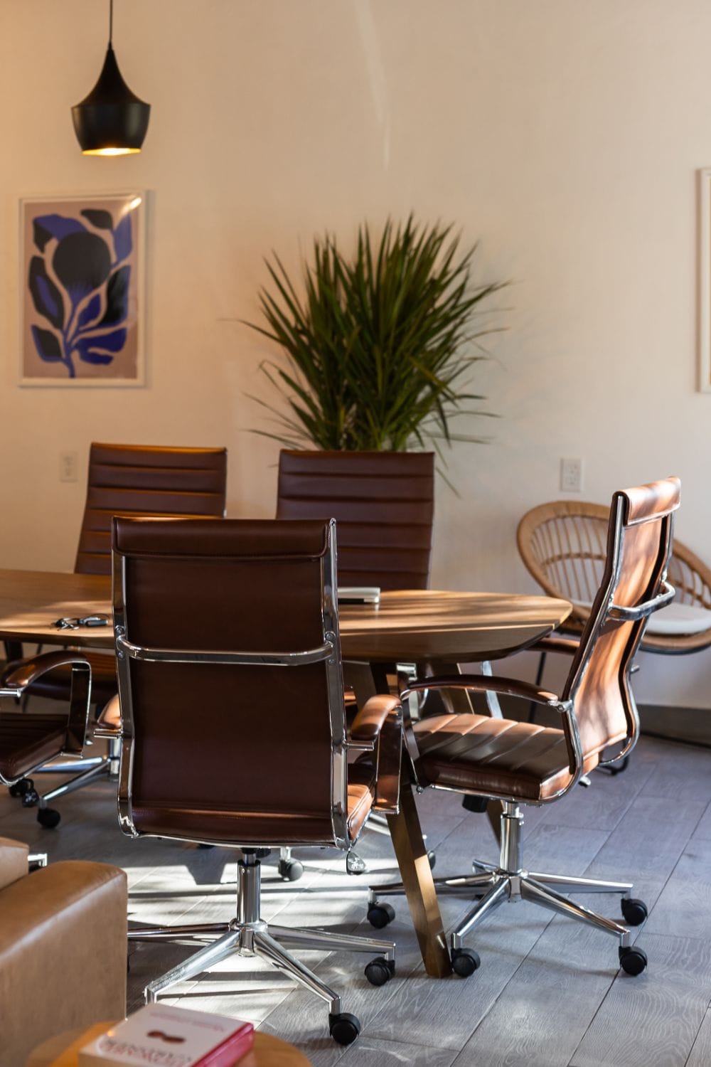 The dedicated coworking room at Outsite San Miguel de Allende with large table, leather chairs, and natural light