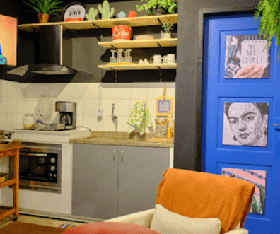 Eclectic shared kitchen with colorful decor at Coliving Muní