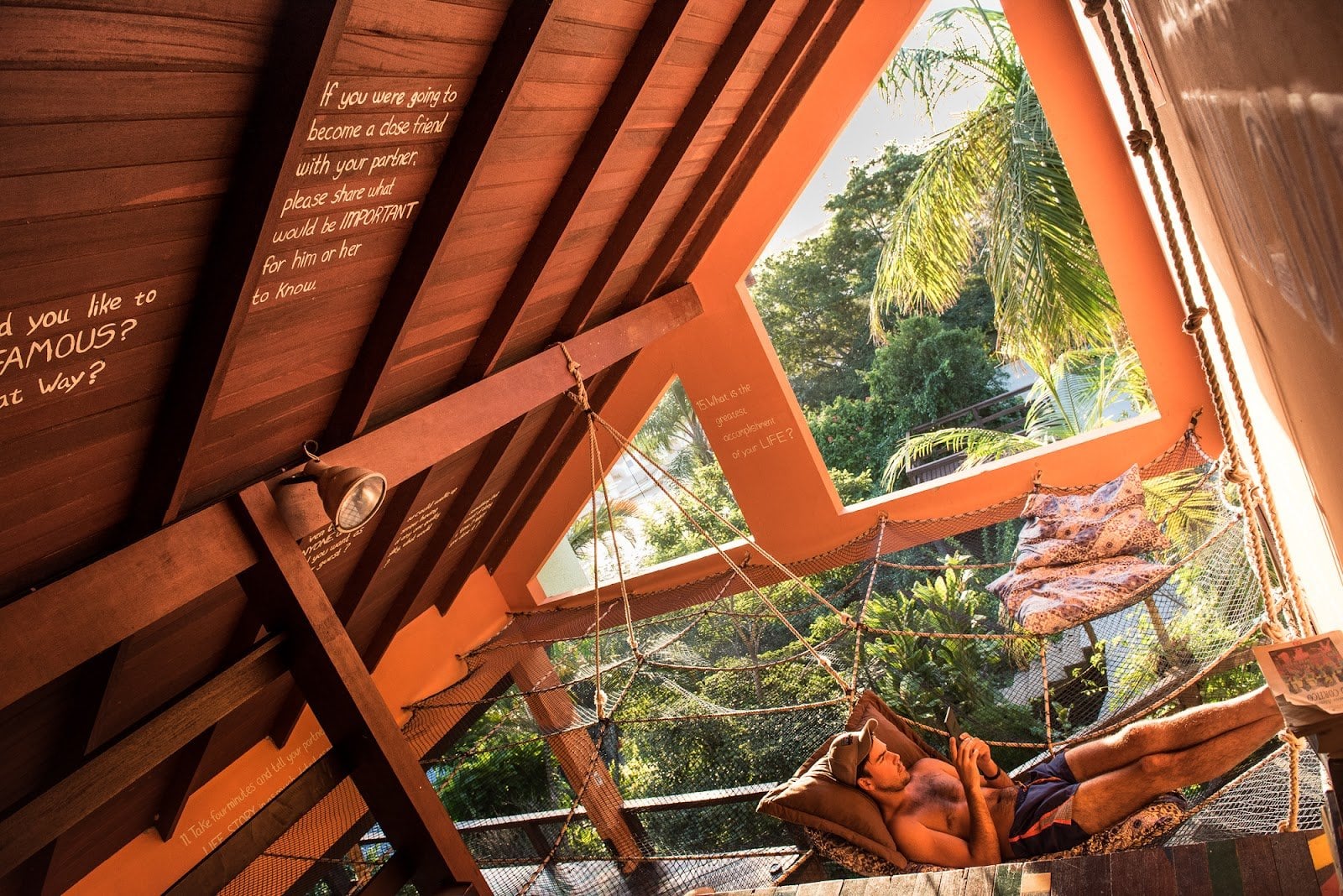 Sunlit A-frame hammock lounge with jungle view at Rosemary Dream Hostel & Coliving, Florianópolis